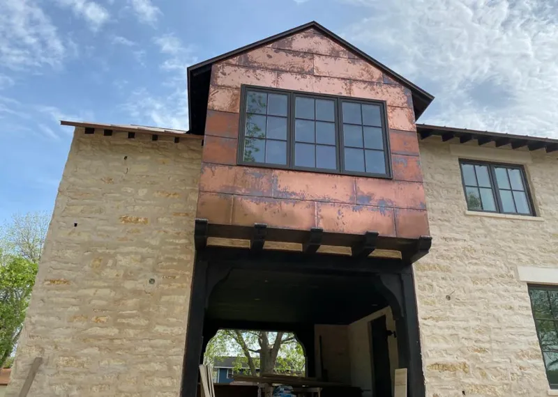 Copper metal panel facade on a stone building for Metal Roof Coating in Vernal
